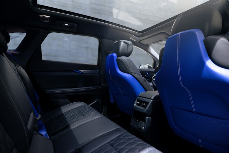 Back Seat View of the 2026 OPTIQ-V Blue Front Seats, Sun Roof, and Interior | James E. Black Cadillac in Ebensburg PA